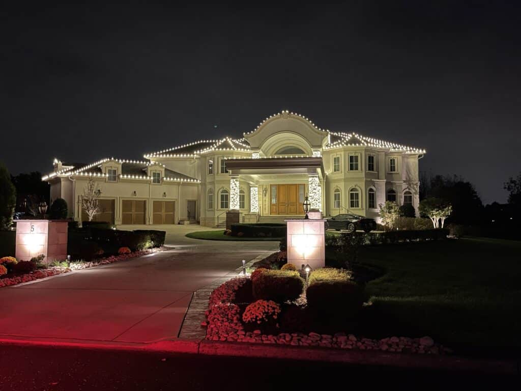 Professional holiday light installation on a residential home in New Jersey with custom roofline Christmas lighting